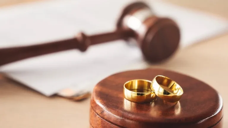 Judge's gavel and wedding rings