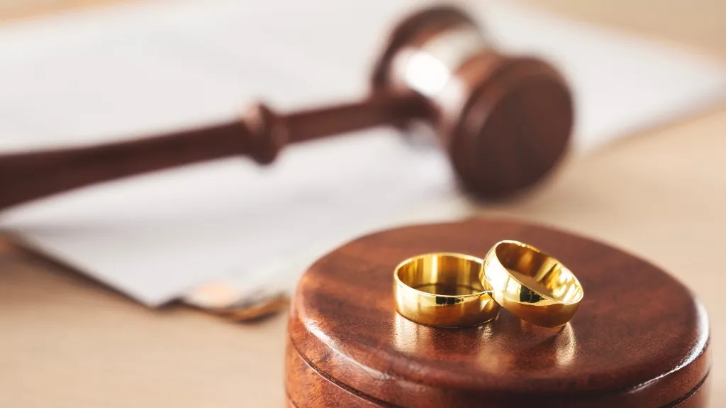 Judge's gavel and wedding rings