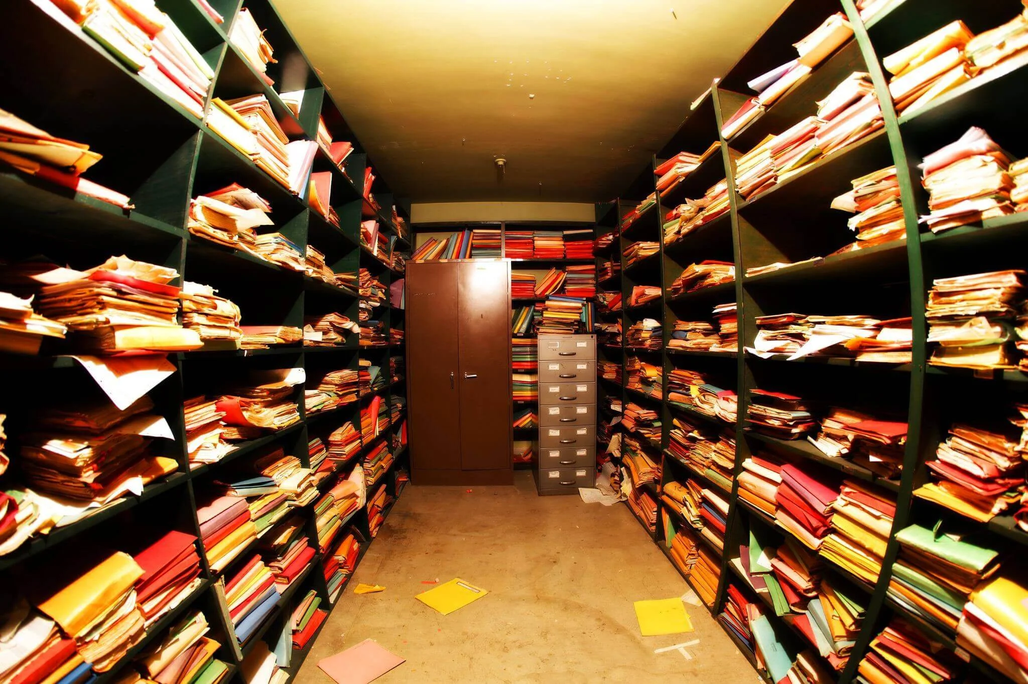a small room containing bookshelves full of books