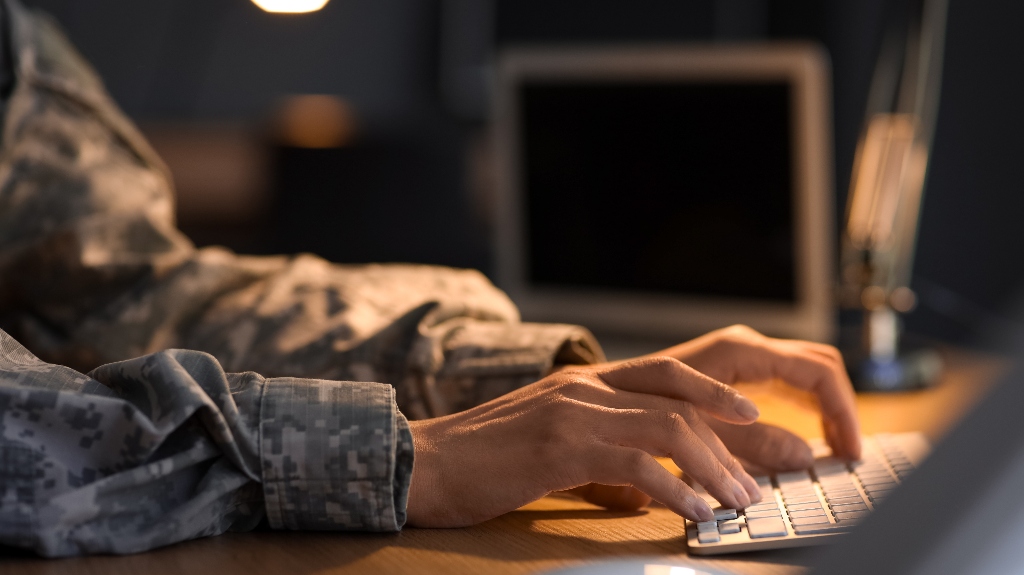 Veteran is using laptop